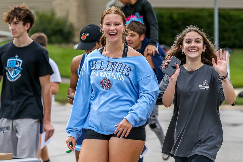 Downers Grove South wrestling athletes march in the Downers Grove South Homecoming Parade. Sept 28, 2024 in Downers Grove.