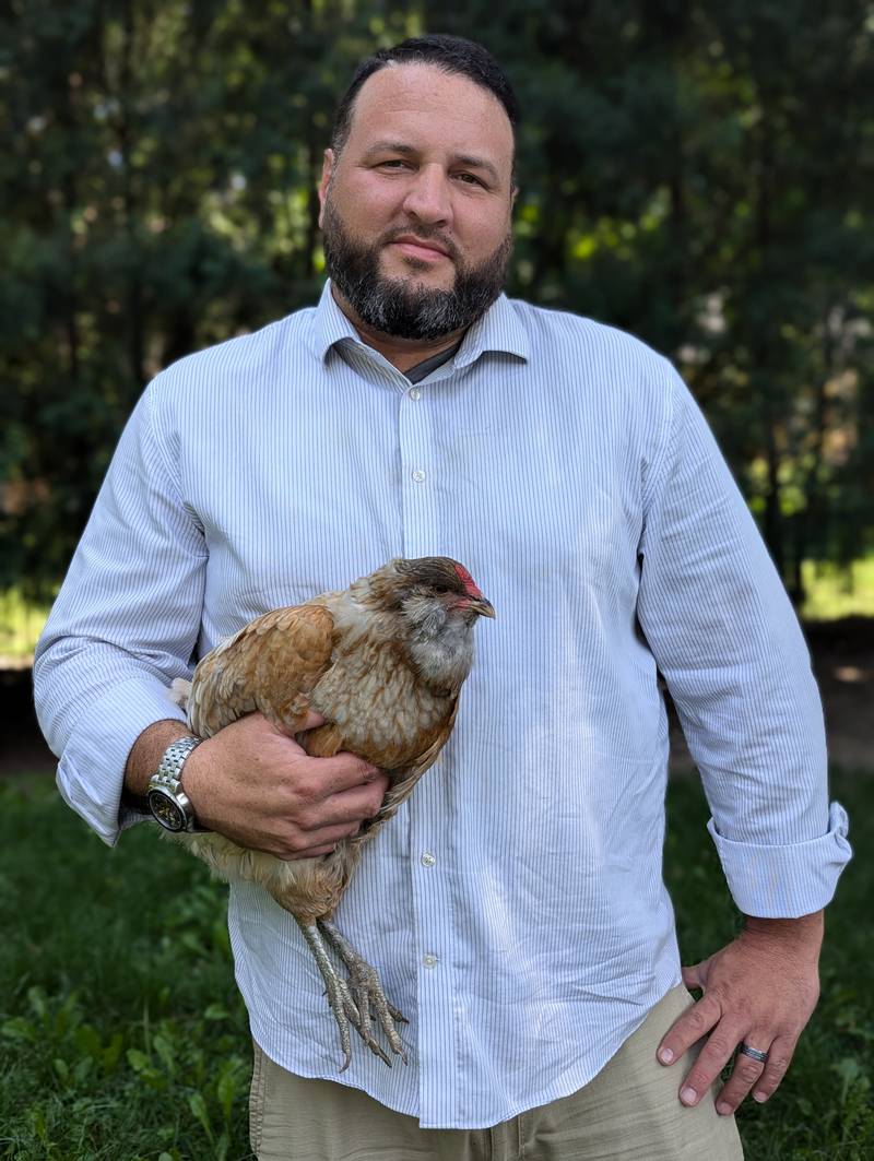 Former Downers Grove firefighter T.J. Aagesen has written a children's book about backyard chickens.