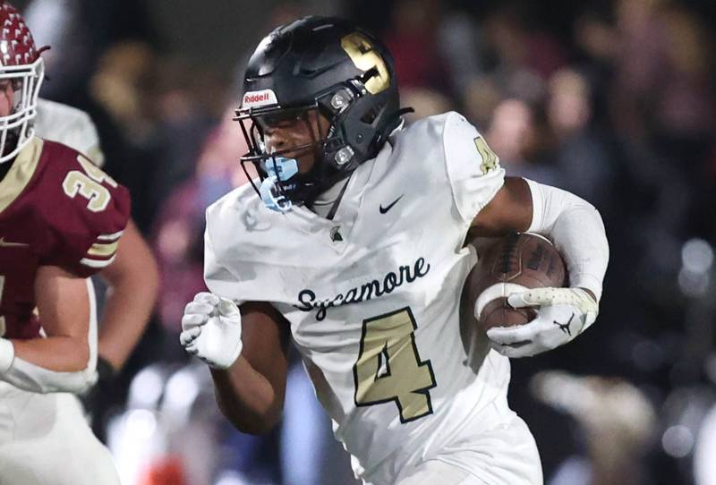 Sycamore's Tyler Curtis goes by Morris’ Connor Mettille during their game Friday, Oct. 20, 2023, at Morris High School.