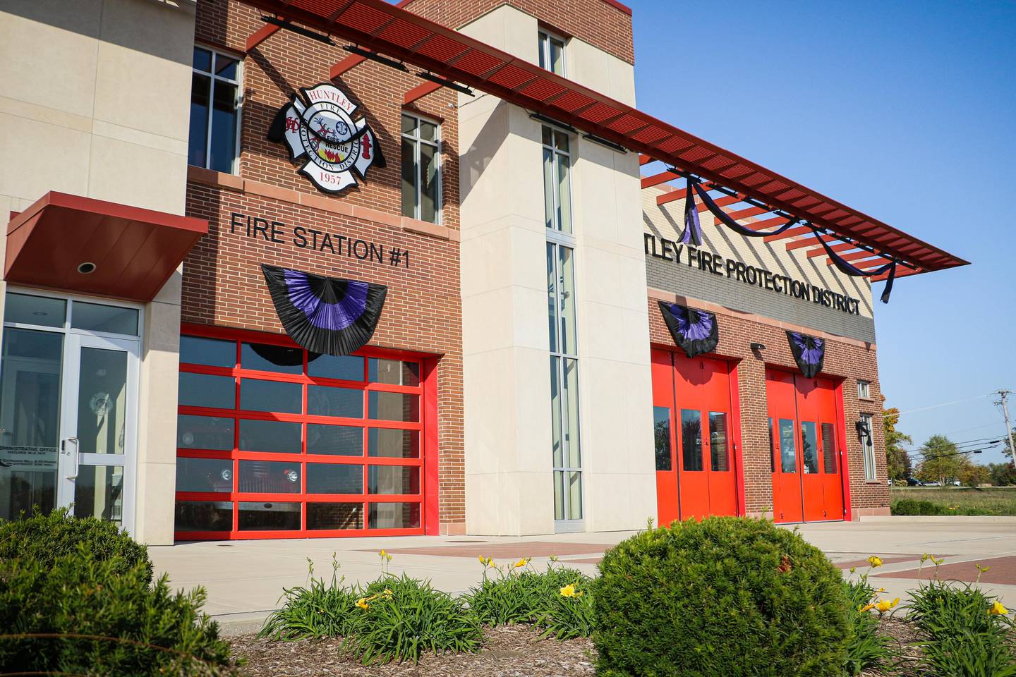 Purple and black bunting is hung at a Huntley fire station on Oct. 11, 2024, to mark the death of Lt. Ken Larsen.