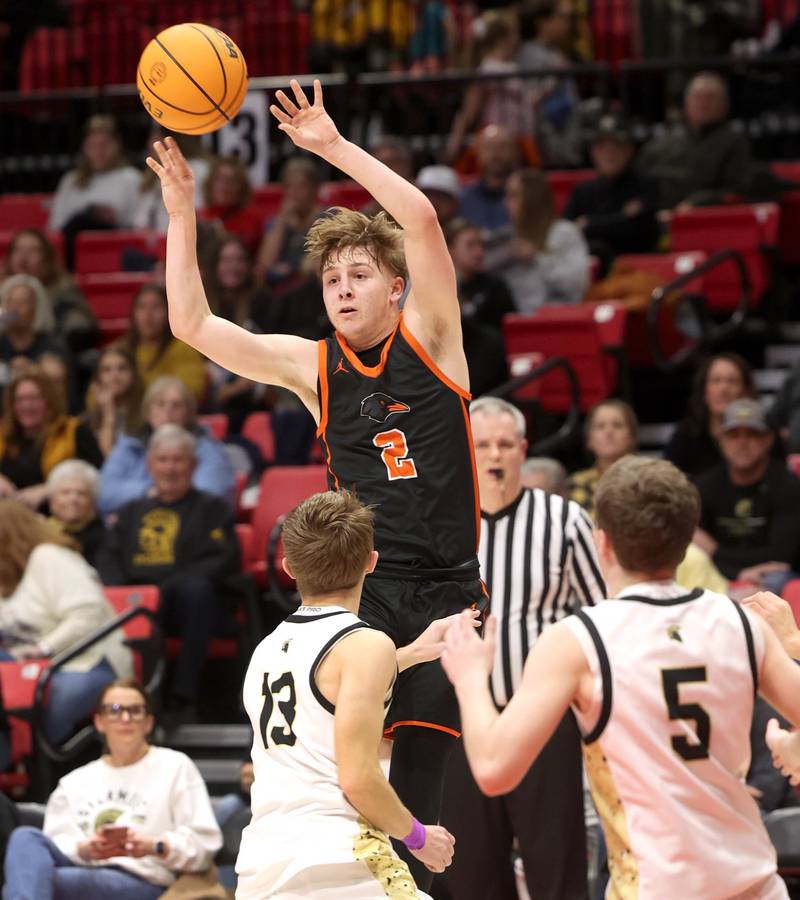 DeKalb's Sean Reynolds passes the ball over Sycamore's Xander Lewis (left) and Preston Picolotti during their game Friday, Jan. 31, 2025, in the FNBO Challenge in the Convocation Center at Northern Illinois University in DeKalb.