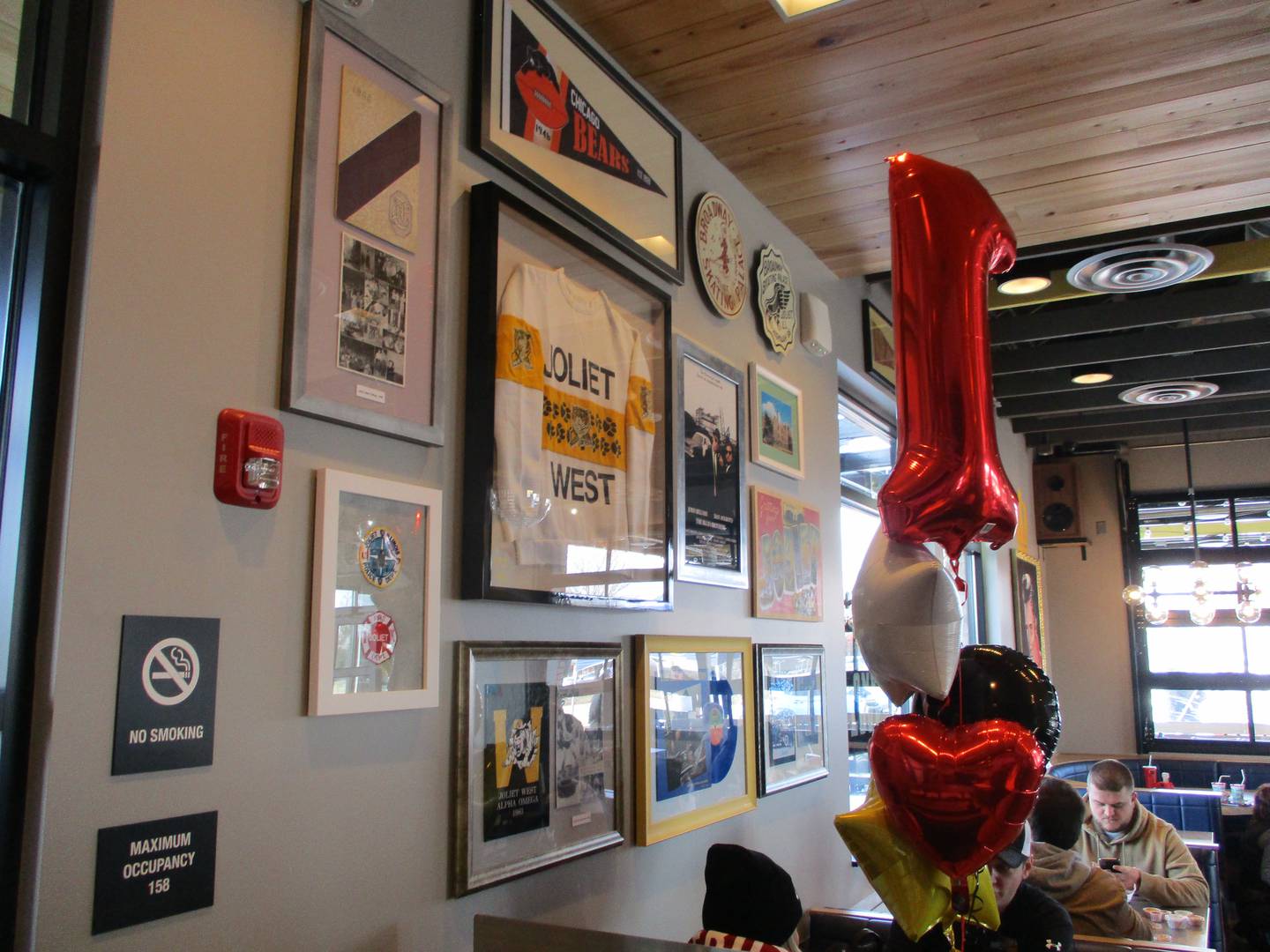 Tributes to Joliet West High School and other local institutions are on display at the Raising Cane's Chicken Fingers, which opened Tuesday, March 8, 2022 at 3000 Plainfield Road in Joliet.