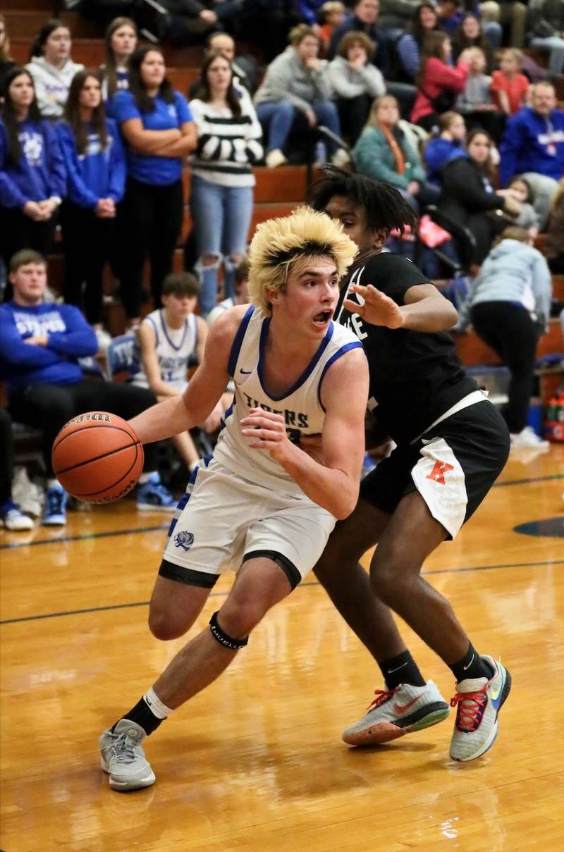 Princeton's Noah LaPorte drives around Kewanee Catrelle Reed Tuesday night at Prouty Gym. The Tigers won 61-55.