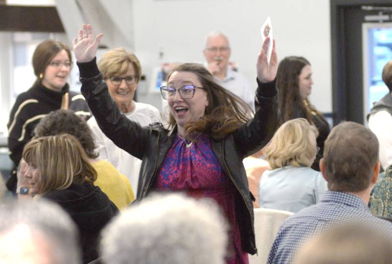 Amanda Bordner reacts as she 'dashes' to her art choice during the Serenity Hospice and Home’s Fourth Annual Art Dash fundraiser on Wednesday, April 9, 2025, at River’s Edge Experience, 103 S. First St., Oregon.