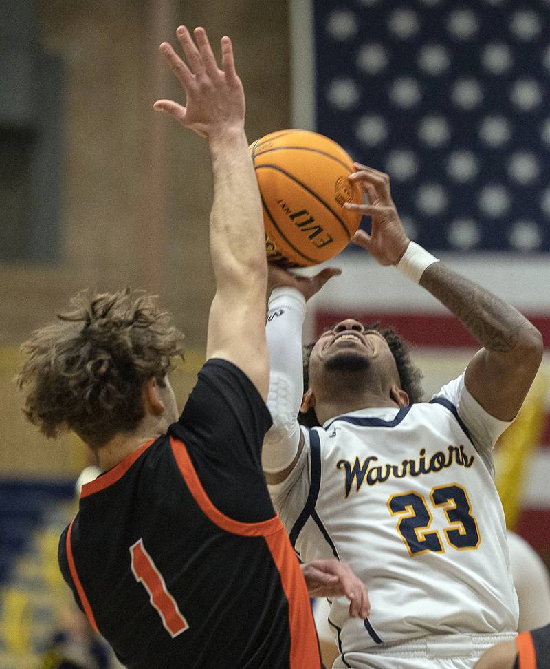 Sterling’s Kaedon Phillips looks to put up a a shot over UT’s Tyler Horvath Tuesday, Jan. 14, 2025.