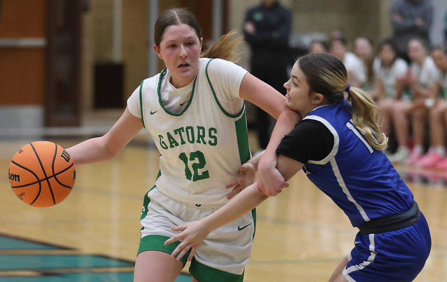Crystal Lake South's Makena Cleary drives to the basket against Woodstock's Reese Zawisza during the IHSA Class 3A Woodstock North Regional championship girls basketball game on Thursday, Feb. 19, 2026, at Woodstock North High School.