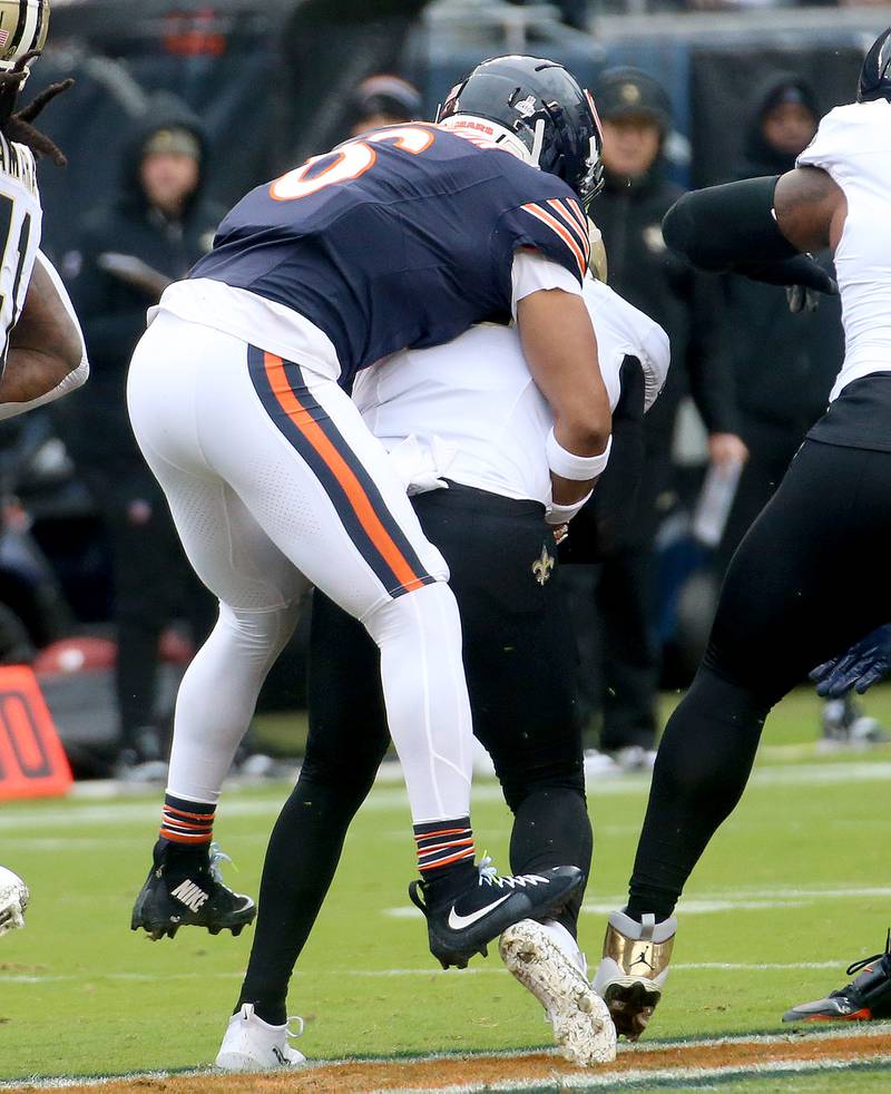 Chicago Bears defensive back Kyler Gordon hops on the back of New Orleans Saints quarterback Spencer Rattler to get the sack on Sunday, Oct. 19, 2025 at Soldier Field in Chicago.