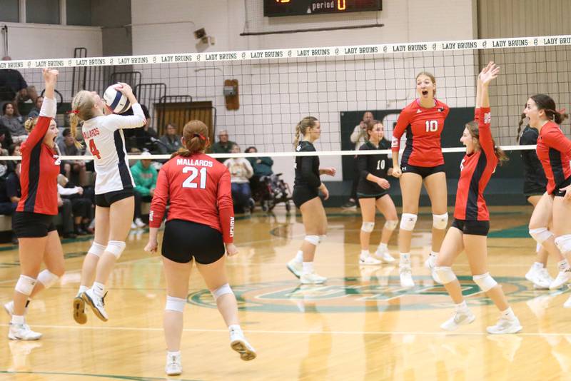 Members of the Henry-Senachwine volleyball team react after winning the Class 1A Regional final over St. Bede on Thursday, Oct. 31, 2024 at St. Bede Academy.