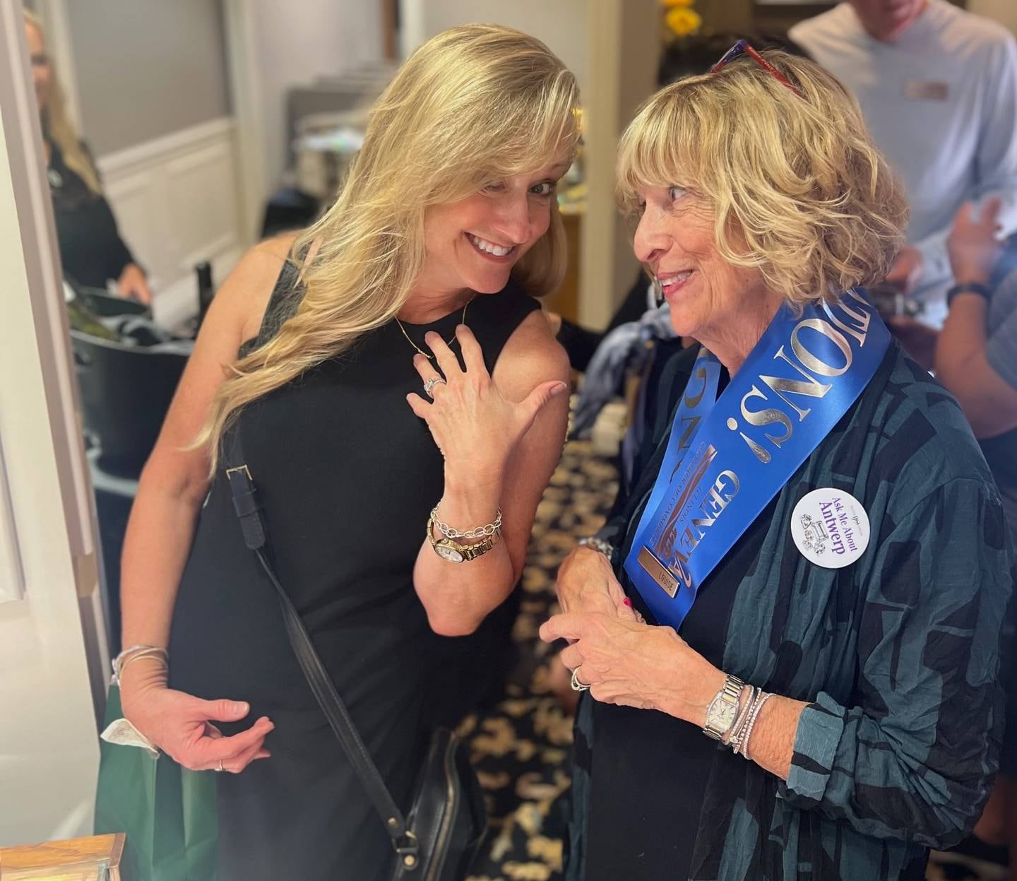 Karen Townsend(left) and State Street Jewelers team member Louise Aughnay share a moment at a party Sept. 25, 2025, following a ribbon cutting to mark the store's 40th anniversary.