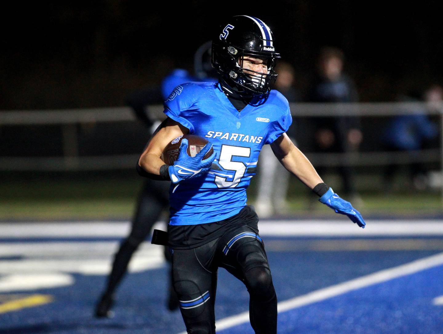 Zach Washington of St. Francis carries the ball for a touchdown during a Class 5A first-round game against Sterling on Friday, Nov. 1, 2024 in Wheaton.