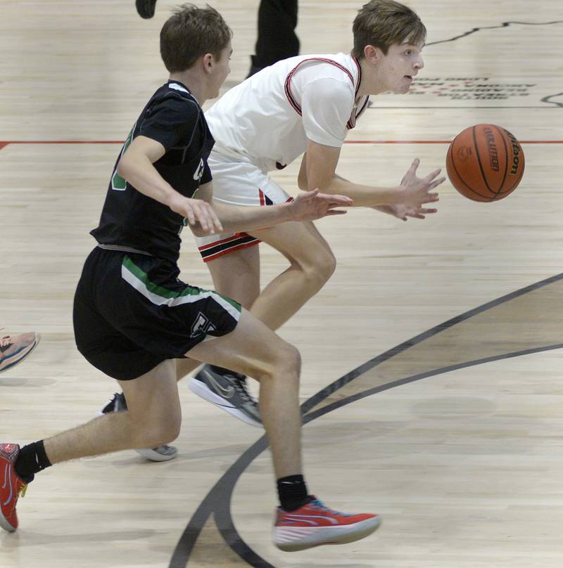 Woodland’s Tucker Hill drives past Cornerstone Christian’s Ben Thoma Monday in the 2nd period at Woodland