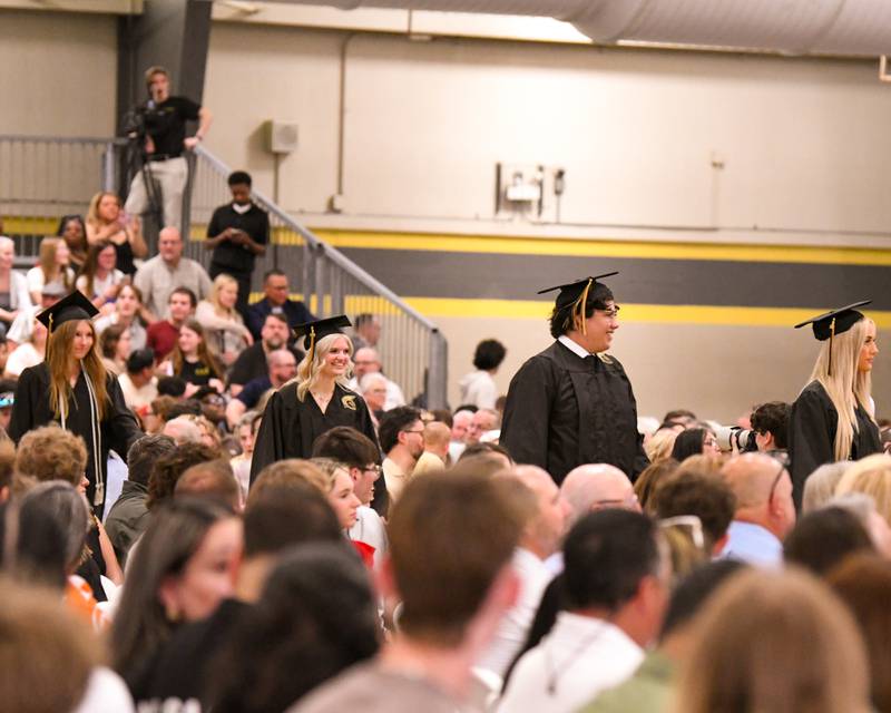 Seniors at Sycamore High School enter during the graduation processional on Sunday, May 24, 2026, at the high school fieldhouse.