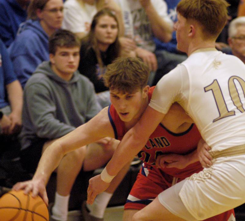Eastland's Harper Keim gets the ball past Pecatonica's Cooper Hamilton. The Eastland Cougars faced the Pecatonica Indians in Friday’s Class 1A Orion Sectional final at Orion High School on March 6, 2026. Eastland won the game 48-41.