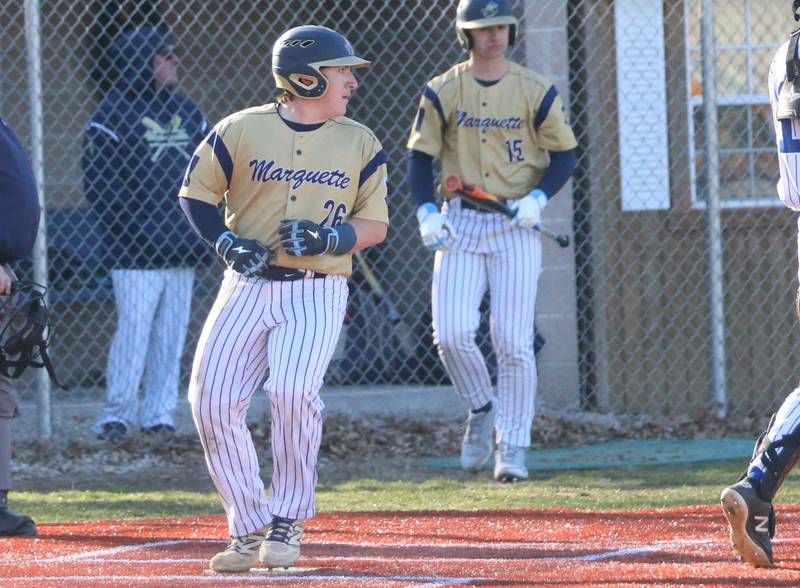 Marquette's Braxton Nelle scores a run against Newark on Monday, March 23, 2026 at Newark High School.