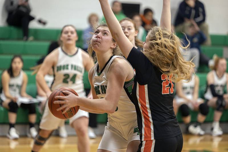 Rock Falls’ Claire Bickett works below the basket against Winnebago Friday, Jan. 20, 2023.