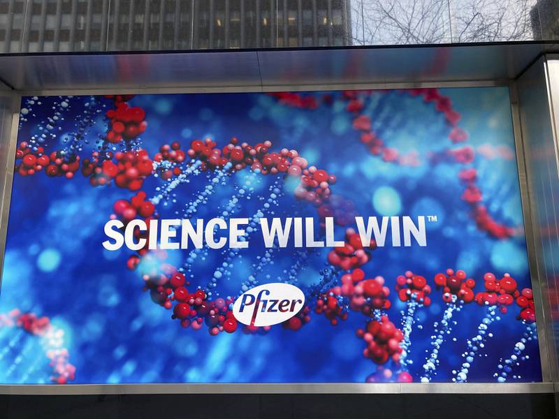 DECEMBER 22nd 2021: Pfizer receives approval from the Food and Drug Administration (FDA) for Paxlovid - the first antiviral COVID-19 coronavirus treatment pill authorized for ill people to take at home before they become sick enough to be hospitalized. - NOVEMBER 16th 2021: Pfizer submits Food and Drug Administration (FDA) application for emergency approval of its COVID-19 coronavirus treatment pill. - File Photo by: zz/STRF/STAR MAX/IPx 2020 12/18/20 Pfizer Inc. continues the initial rollout and worldwide distribution of the Pfizer-BioNTech COVID-19 vaccine. Here, a view of Pfizer World Headquarters in Midtown Manhattan, New York City on December 15, 2020 - with signs of phrases proclaiming that scientific breakthroughs and medical advancements will defeat coronavirus. (NYC)