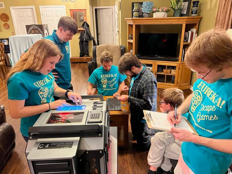 A group plays the bomb disposal version of Eureka! Escape Games’s on Friday, Oct. 14, 2022. Led by game master Jacob Renz, players have 60 minutes to diffuse a bomb in the escape room game they bring to players.