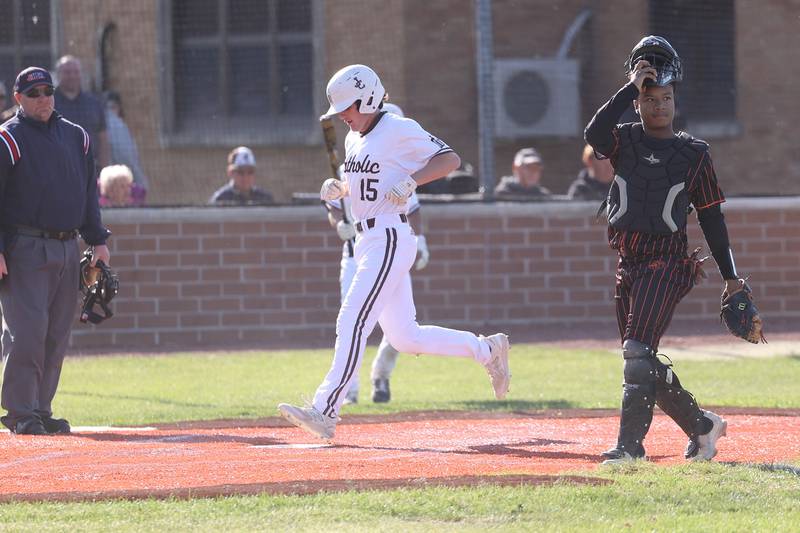 Joliet Catholic’s Graham Roesel scores on an error against Leo in the Class 2A sectional semifinal on Thursday, May 25, 2023, in Joliet.