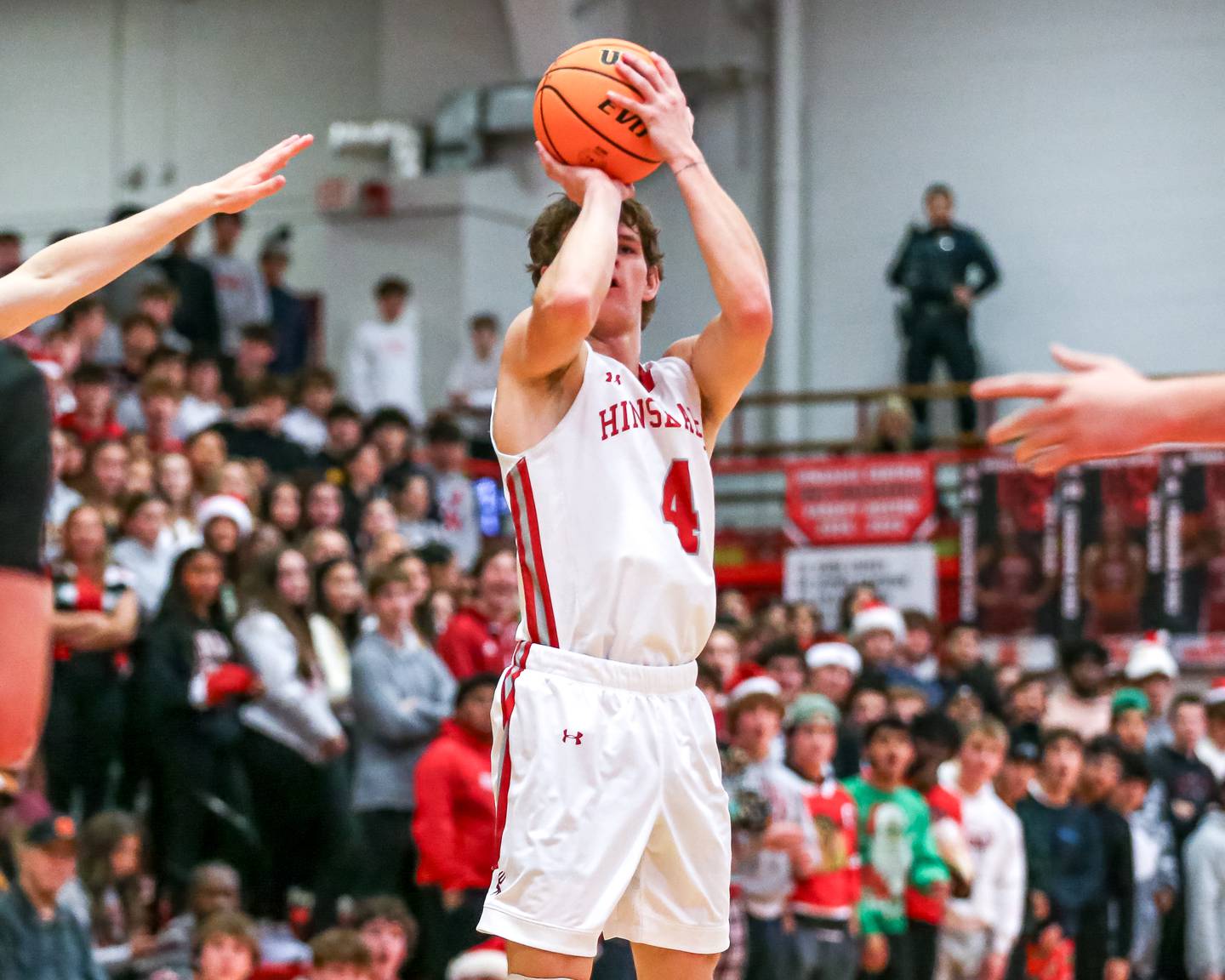 Hinsdale Central's Vince Buzelis (4) shoots a jumper during their basketball game between Glenbard West at Hinsdale Central, Friday  Dec 6, 2024  in Hinsdale.