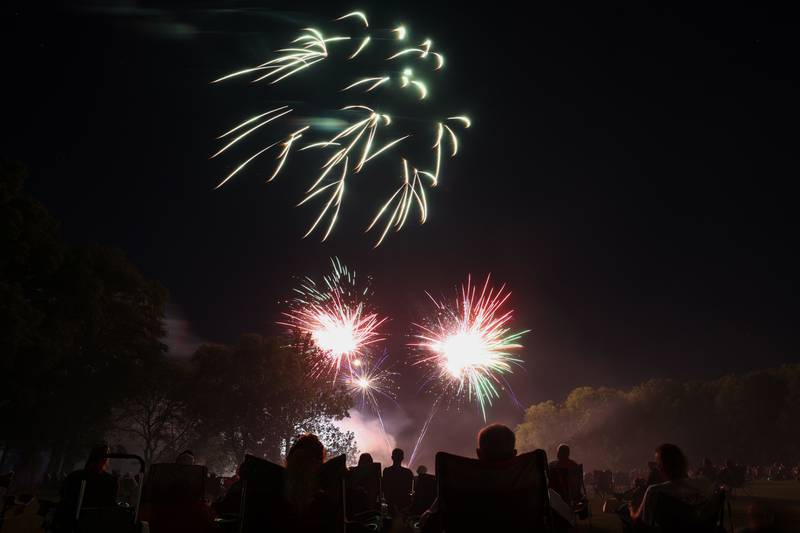 Spectators watch the city of Kankakee's fireworks show at Kankakee Community College on Friday, July 4, 2025.