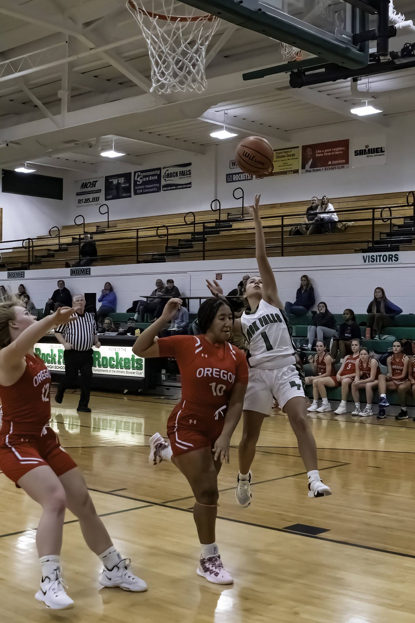 Rock Falls' Elizabeth Lombardo (1) shoots over Oregon's Mariah Drake (10) during their Big Northern Conference game Friday night at Tabor Gym.