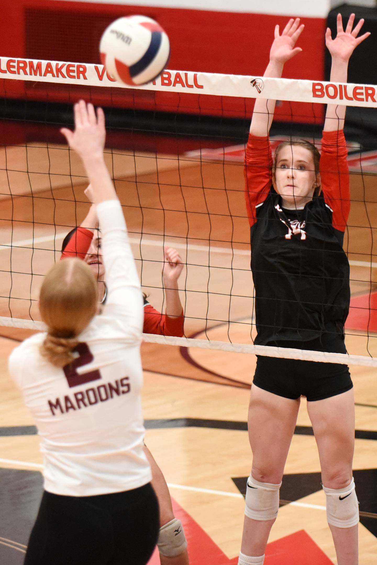 Bradley-Bourbonnais' Jamisen Parker, right, looks to block a hit from Champaign Central's Hayden Curtis during a game at Bradley-Bourbonnais Thursday, Oct. 23, 2025.