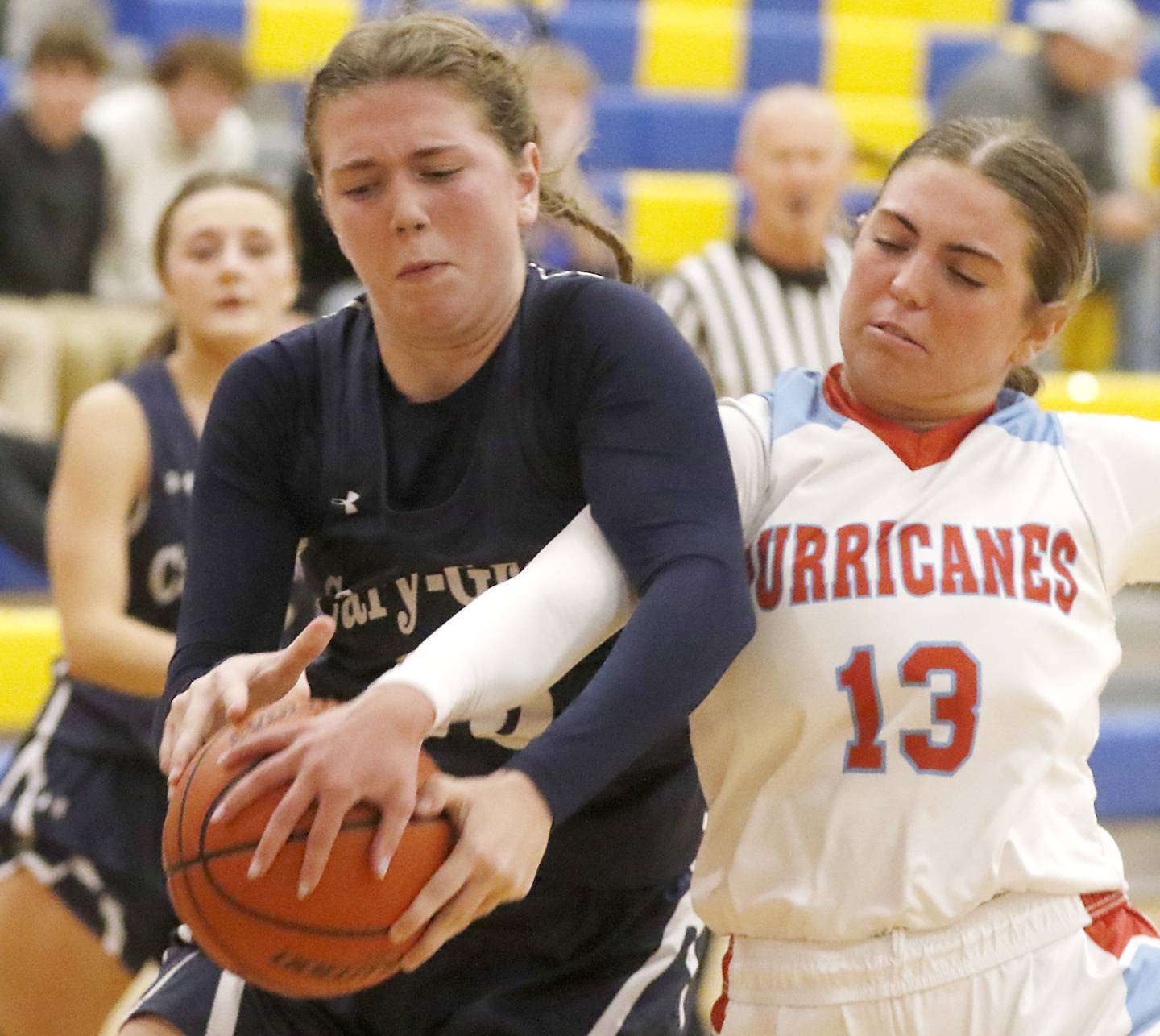 Cary-Grove's Ellie Mjaanes and Marian Central's Lucy Iden battle for a rebound on Thursday, Nov. 16, 2023, during Johnsburg Thanksgiving Tournament girls basketball game at Johnsburg High School.