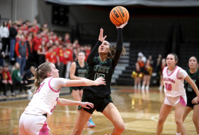 Glenbard West's Hannah Roberts gets a shot up during the Class 4A St. Charles East Sectional final against Batavia on Thursday, Feb. 27, 2025 in St. Charles.