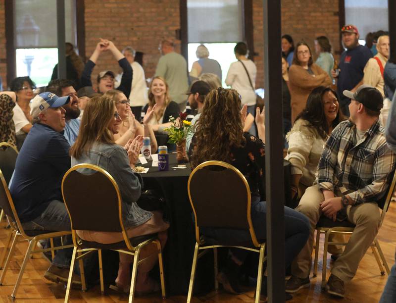 Guests listen to music by the band Wreckin' Dixie during the WALLS 102 Listener Appreciation Party on Friday, May 8, 2026 at the Auditorium Ballroom in La Salle.