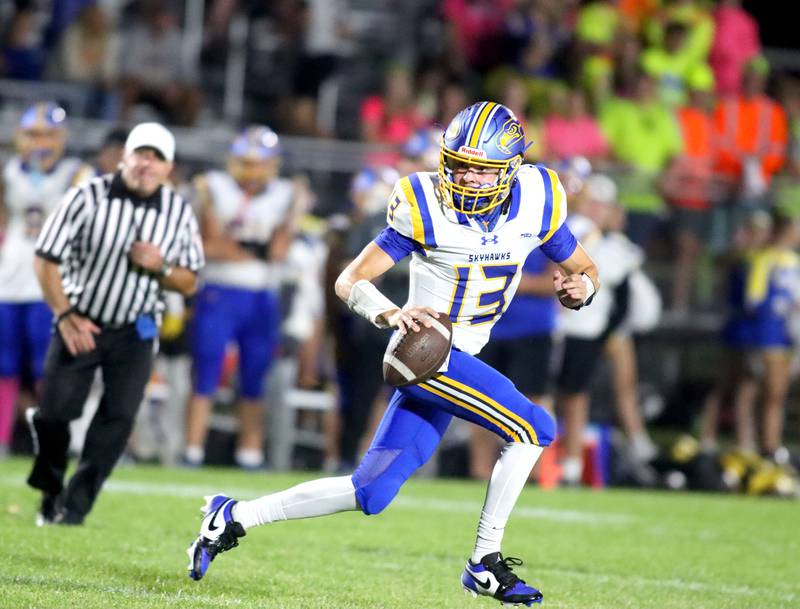 Johnsburg’s Carter Block scrambles with the ball in varsity football at Rod Poppe Field on the campus of Marengo High School in Marengo on Friday, Oct. 3, 2025.