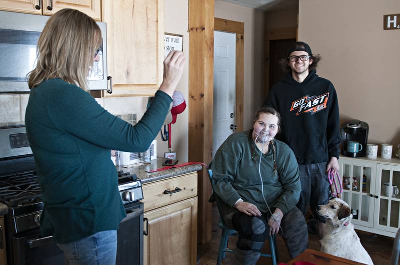 Carlie, Brandon and Bella pose for a photograph, the first one the couple has had together since their wedding in September.