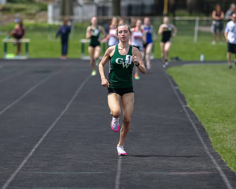 Glenbard West's Audrey Allman finishes first in heat 3 of the 800 meter run at the Glenbard West's Sue Pariseau Girls Track and Field Invitational.  April 23.2022.
