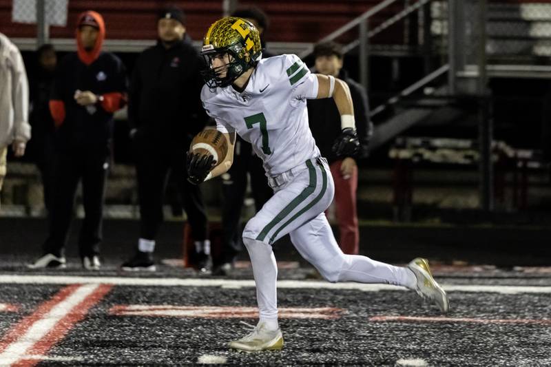 Fremd's Ben Riddle picks-up yardage during an 8A varsity football playoff game against Bolingbrook at Bolingbrook on Nov. 15, 2025.