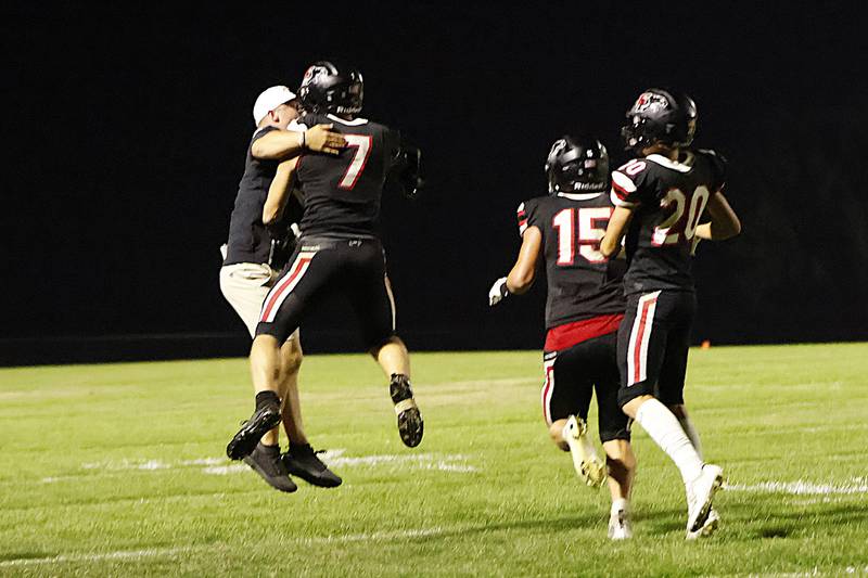 After a real nail biter of a game, EP Panther #7 Gaven Adams and Assistant Coach Tristan Demay celebrated the Panthers homecoming victory over the Riverdale Rams. With 1 second left on the clock, Adams and teammate Connor Keegan swatted down the Rams pass in the end zone that would have tied the game. Final score EP 42, Riverdale 36.