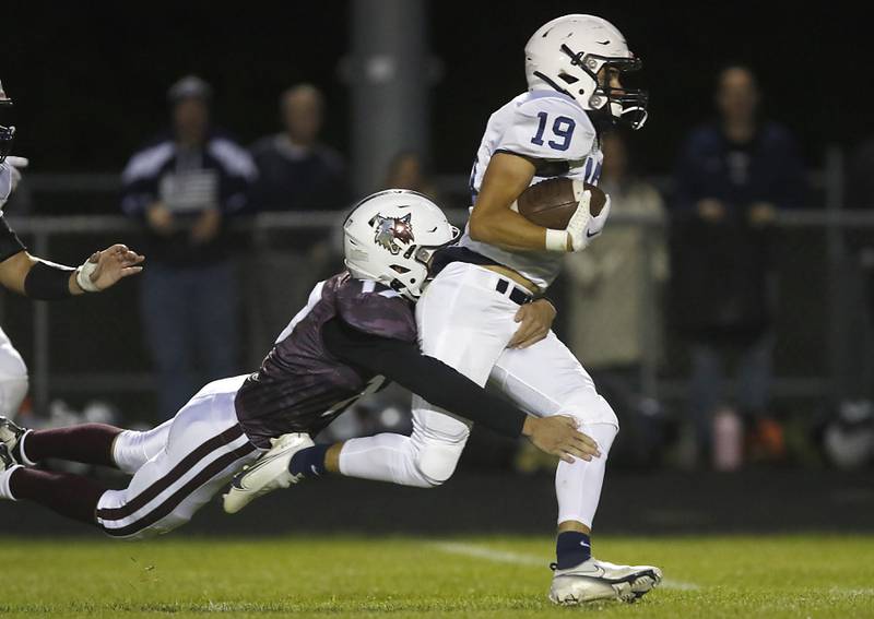 Prairie Ridge's Logan Harlow tackles Cary-Grove's Andrew Prio from behind during a Fox Valley Conference football game between Prairie Ridge  and Cary-Grove Friday, Sept. 23, 2022, at Prairie Ridge High School in Crystal Lake.