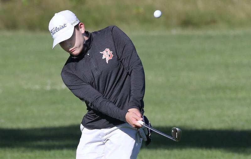 DeKalb's Jonah Keck chips onto the 4th green Tuesday, Aug. 9, 2022, during golf practice at River Heights Golf Course in DeKalb.