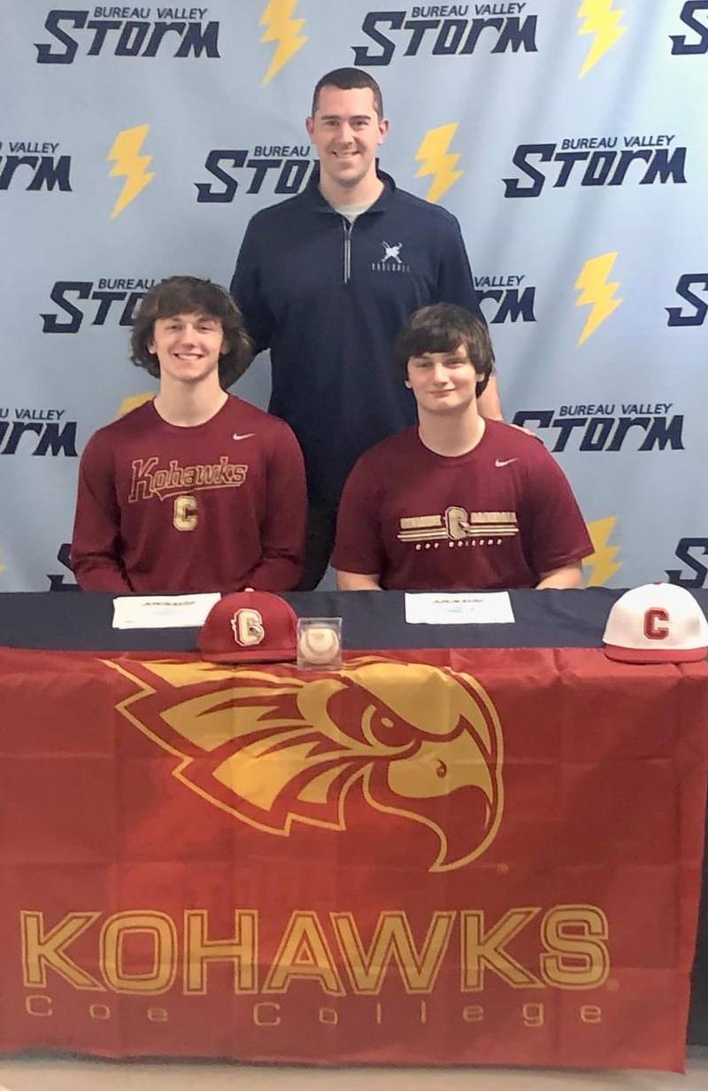 Bureau Valley seniors Sam Wright (left) and Sam Rouse sign to play baseball for Coe College in Cedar Rapids, Iowa next year. They are joined by Storm coach Ryan Schisler, who played and coached for Coe.