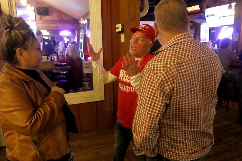 Illinois State Sen. Craig Wilcox, center, talks with supporters during a Republican election night watch party Tuesday, Nov. 8, 2022, at Niko's Red Mill Tavern, 1040 Lake Ave. in Woodstock. The event was hosted by Wilcox, McHenry County Board Chairman Mike Buehler, McHenry County Coroner Michael Rein, and McHenry County Clerk Joe Tirio.