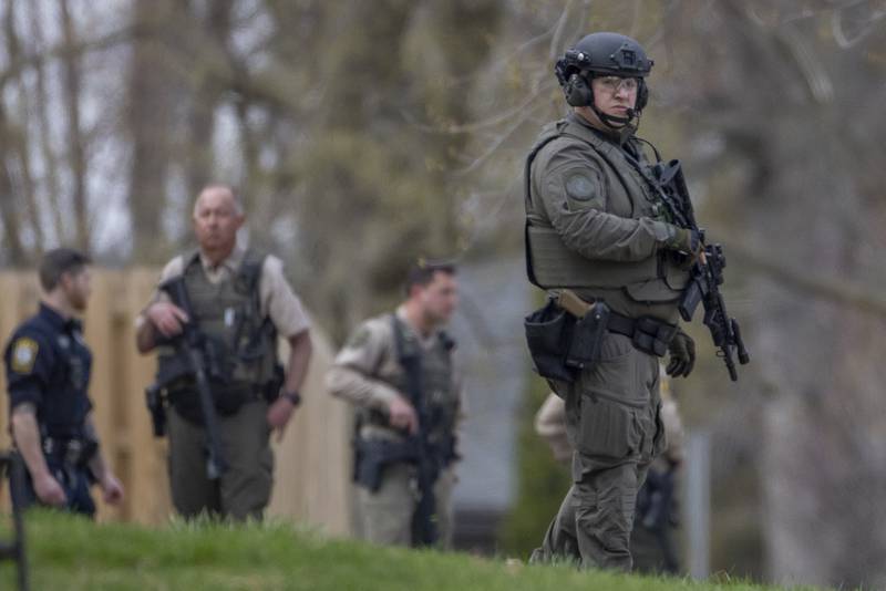 A S.W.A.T officer exits the two story apartment building just after the final shot was fired. The incident occurred on the corner of Seventh and Charters on Sunday, March 30, 2025 in La Salle. A barricaded armed subject fired shots at officers. Police from across the Illinois Valley assisted in the incident.