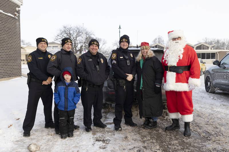 Operation Santa is in full swing Saturday, Dec. 24, 2022. Donations from the community allowed the Rock Falls Police Department to supply gifts, food and household items to local families in the spirit of the season. Pictured: Chief Dave Pilgrim, Zach Lyerla and son Zayden, Rollie Elder, Ryan McKenna, Joy Colberg and Santa Jon Colberg.