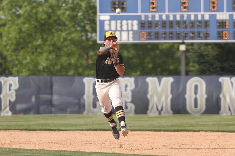 Hinsdale South’s Max Waszkiewicz makes a throw to first for the out against Lemont on Wednesday, May 24, 2023, in Lemont.