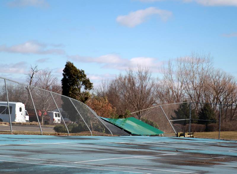 Trees, signs and fences were damaged on the Waubonsee Community College campus in Sugar Grove on Wednesday, Feb. 28, 2024 following a reported tornado the night before.