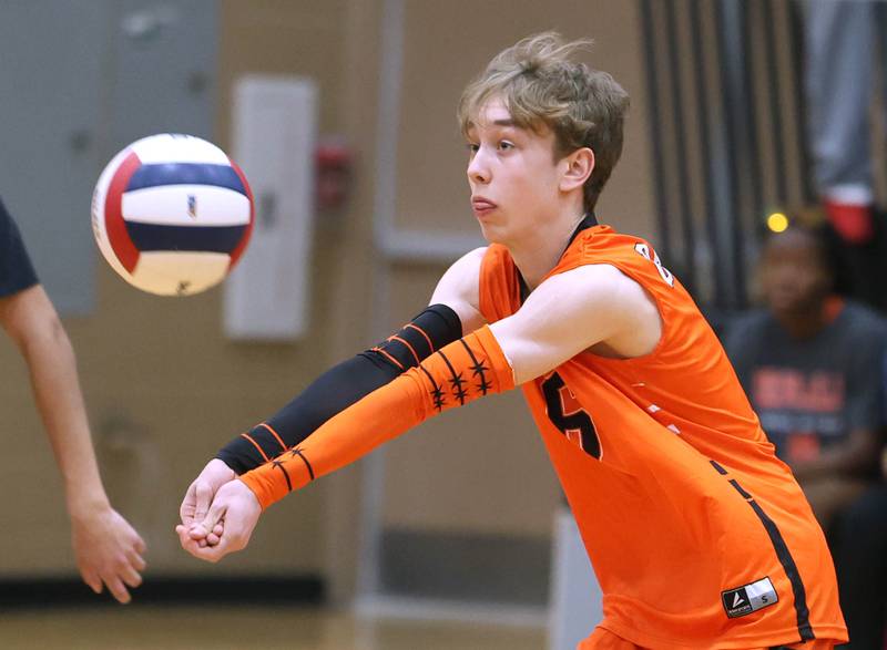 DeKalb’s Joseph Stratton receives a serve Tuesday, April 21, 2026 during their match against Naperville North JV at DeKalb High School.