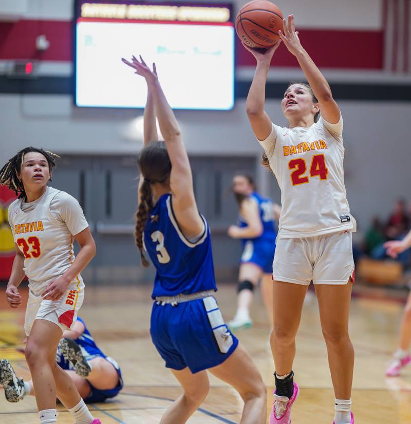 Batavia’s Hallie Crane (24) shoots the ball in the paint over Geneva’s Hope Ieler (3) during a basketball game at Batavia High School on Friday, Jan 26, 2024.