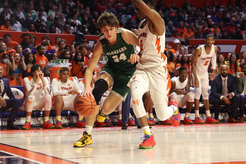 Glenbard West’s Braden Huff drives along the baseline against Whitney Young in the Class 4A championship game at State Farm Center in Champaign. Saturday, Mar. 12, 2022, in Champaign.
