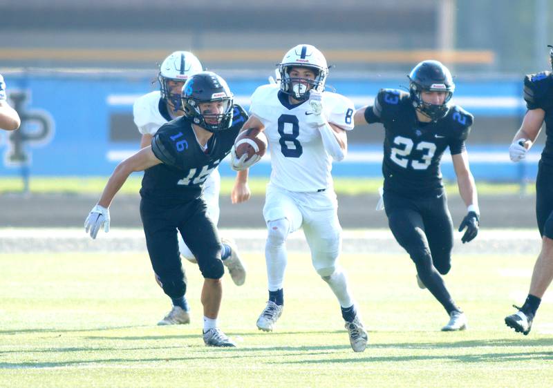 Cary-Grove’s Andrew Prio breaks away to run in a touchdown against Highland Park in second-round IHSA Class 6A playoff action at Wolters Field in Highland Park Saturday.