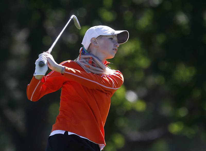 Crystal Lake Co-op’s Rylee Rud watches her tee shot the eight hole during the IHSA Class 2A Huntley Girls Golf Regional on Tuesday, Oct. 1, 2024, at Pinecrest Golf Club in Huntley.