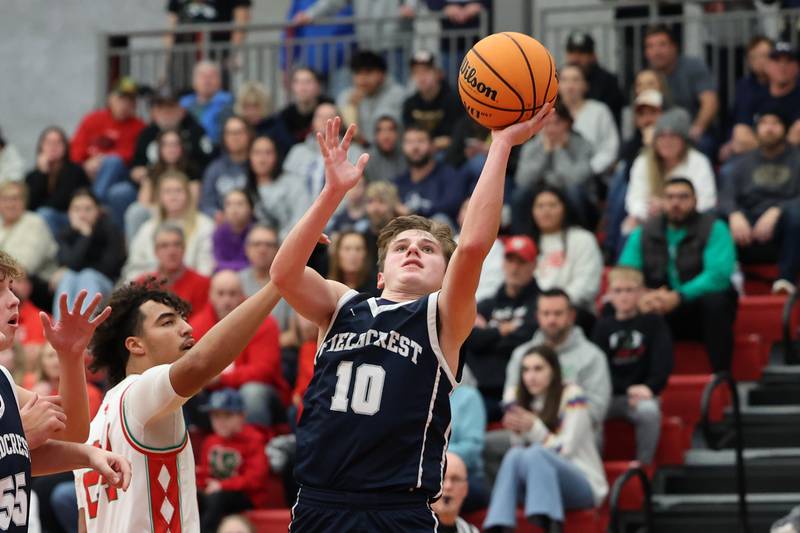 Kash Klendworth of Fieldcrest lays ball up on Saturday, December 14, 2024 at Hall High School in Spring Valley.