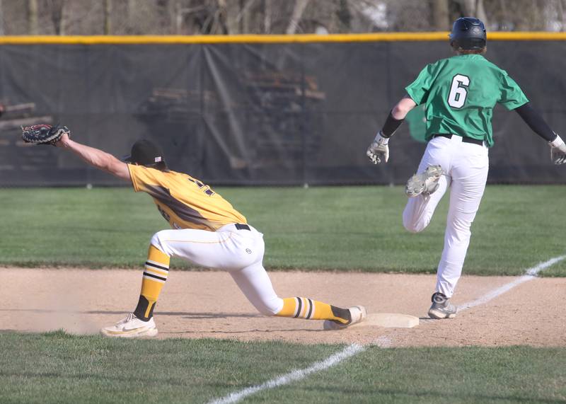 Putnam County first baseman Jackson McDonald stretches to make a catch to force out Seneca's Chase Buis on Thursday, April 13, 2023 at Seneca High School.