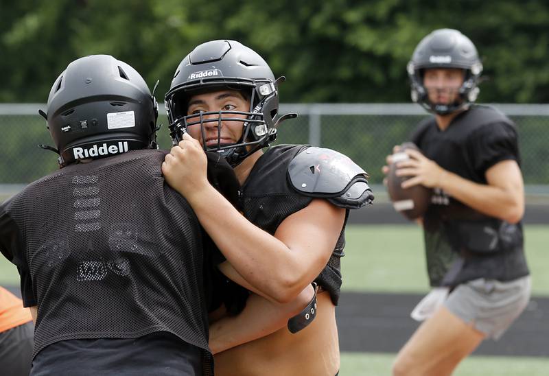 McHenry’s Aiden Ramirez blocks during football practice on Thursday, July 24, 2025, at McCracken Field, in McHenry.